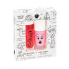 A Nailmatic - Nail Polish + Lipgloss Set - Holidays featuring two cosmetic products, strawberry rollette lipgloss and water-based cookie nail polish, designed with playful cartoon faces and marine-themed doodles. The package states it is made in France.