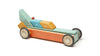 A colorful wooden toy race car featuring a sleek design with teal, blue, and orange blocks from the Tegu 42 Piece Magnetic Wooden Block Set - Sunset, and magnetic wheels, isolated on a white background.