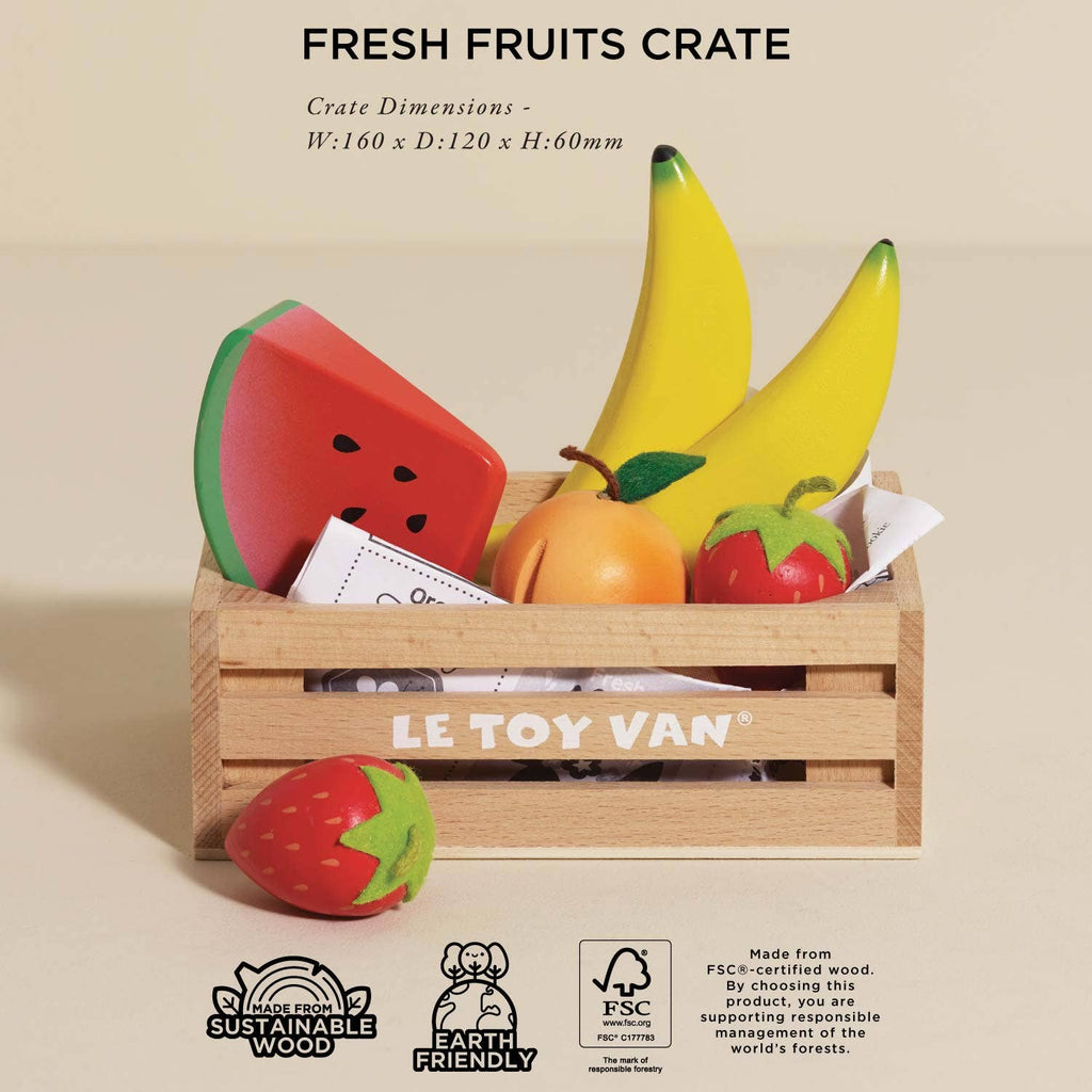 The Smoothie Fruit Wooden Market Crate ships in one week and includes colorful wooden fruits—two bananas, a watermelon slice, an apple, an orange, and a strawberry—in a small crate perfect for imaginative play. Sustainable and sized for little hands.