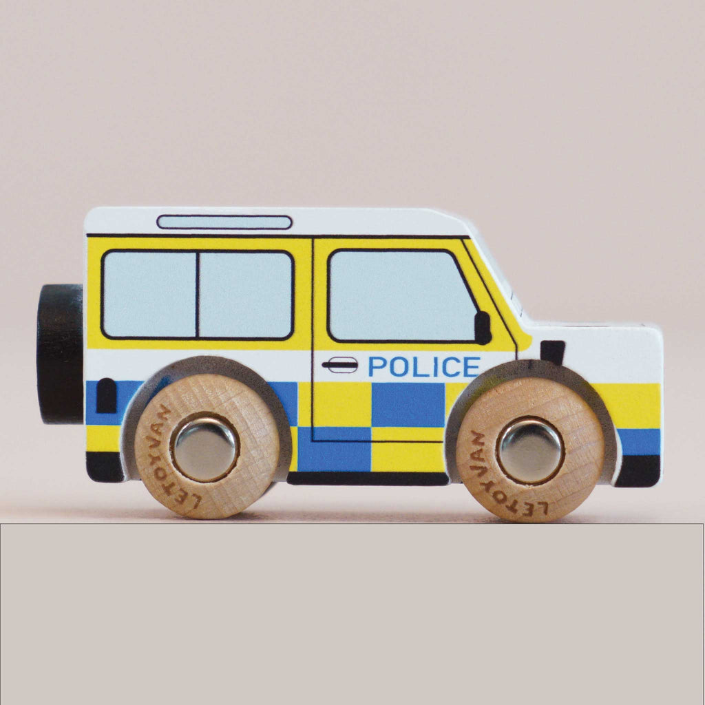 No. 40 GT250 Bobby | Made in England is a wooden police car inspired by a classic British patrol vehicle, featuring yellow and blue checkered details, two sturdy wooden wheels, and “POLICE” written on the side—perfect for imaginative play against a plain background.