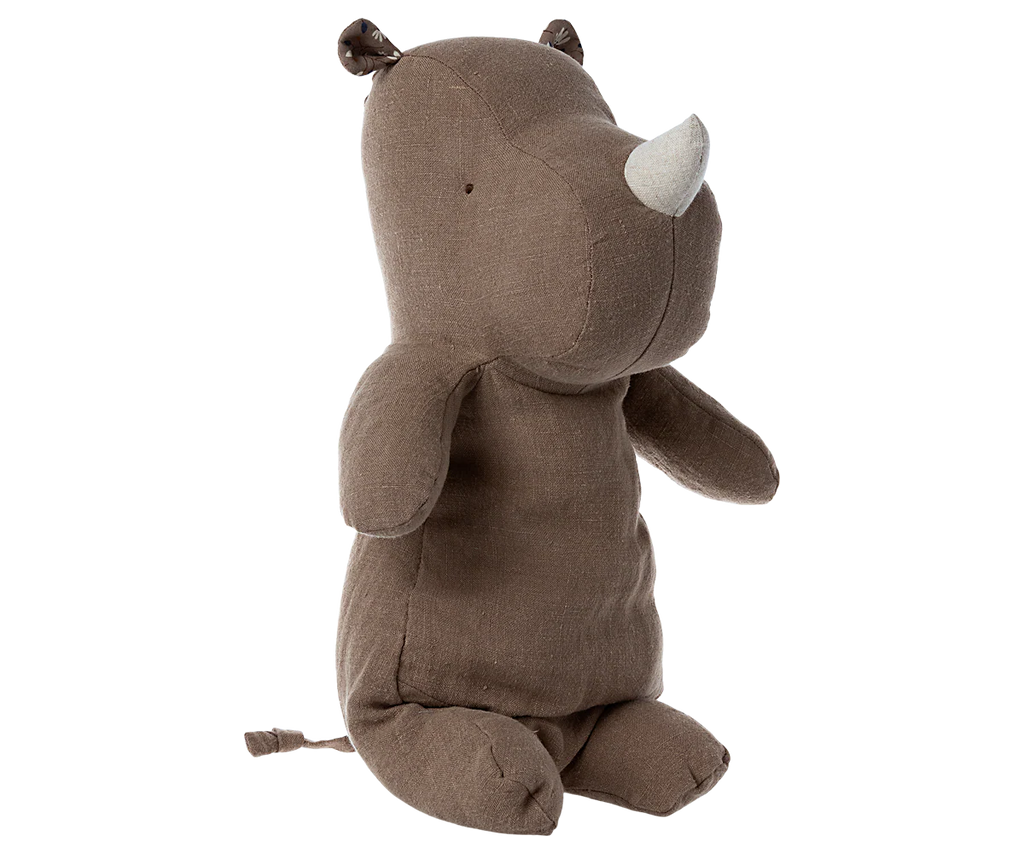 The Maileg Rhino, Medium - Light brown, is a plush stuffed rhinoceros with a small white horn and tiny ears, shown sitting upright against a plain white background.