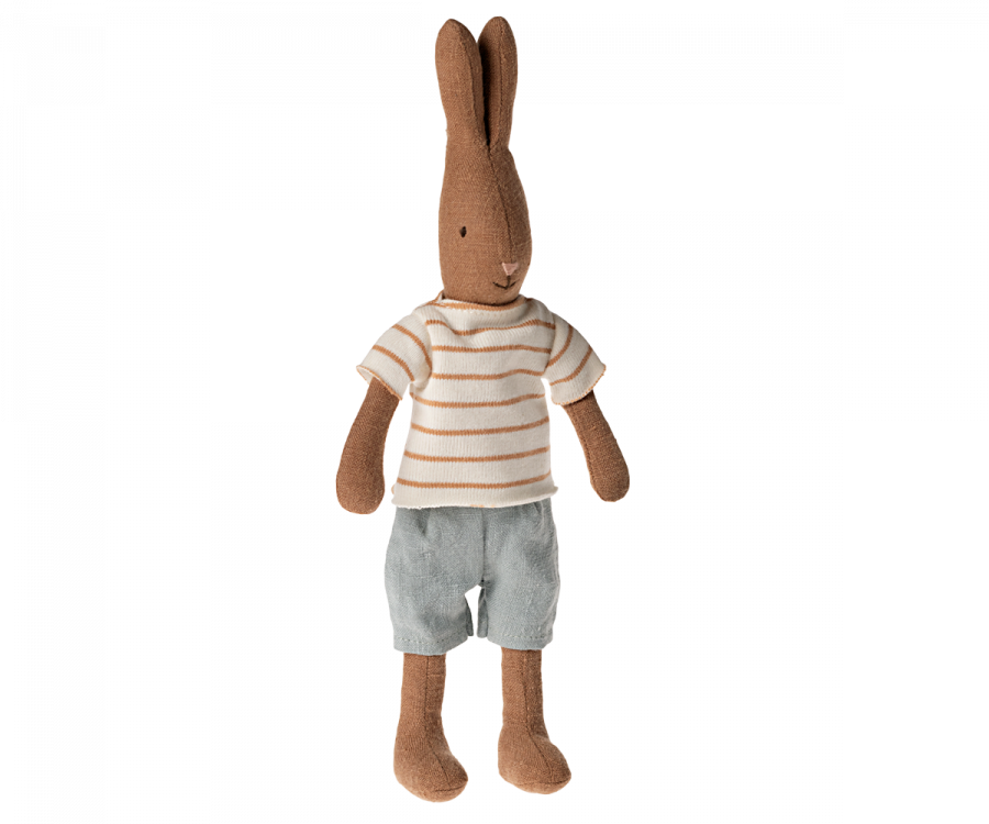 A Maileg Rabbit Size 1, Chocolate Brown - Striped Blouse and Shorts resembling a rabbit, wearing a striped white and beige shirt and light gray shorts. The toy stands upright with long ears, a simple stitched face, and is crafted from soft natural fabrics. This charming bunny wardrobe addition is perfect for any collection.