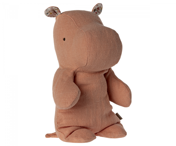 Meet your safari friend, the Maileg Small Hippo Stuffed Animal, crafted from light brown recycled polyester. With small black eyes and patterned ears, it stands upright with slightly extended arms and legs, inviting endless cuddles on all your adventures.