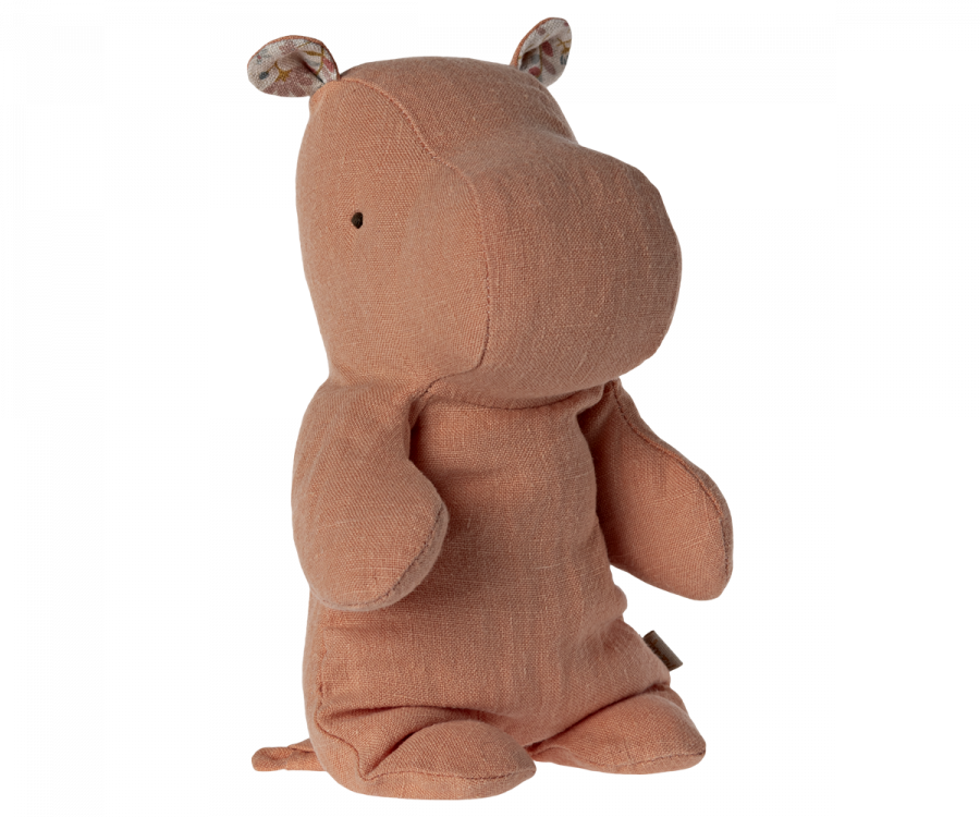 Meet your safari friend, the Maileg Small Hippo Stuffed Animal, crafted from light brown recycled polyester. With small black eyes and patterned ears, it stands upright with slightly extended arms and legs, inviting endless cuddles on all your adventures.