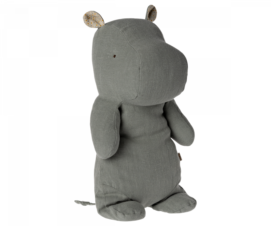 A soft, grey Maileg Medium Hippo Stuffed Animal - Chino Green made from recycled polyester, with subtle polka dots on the inner ears, standing upright on a white background. The toy has a gentle, calm expression.