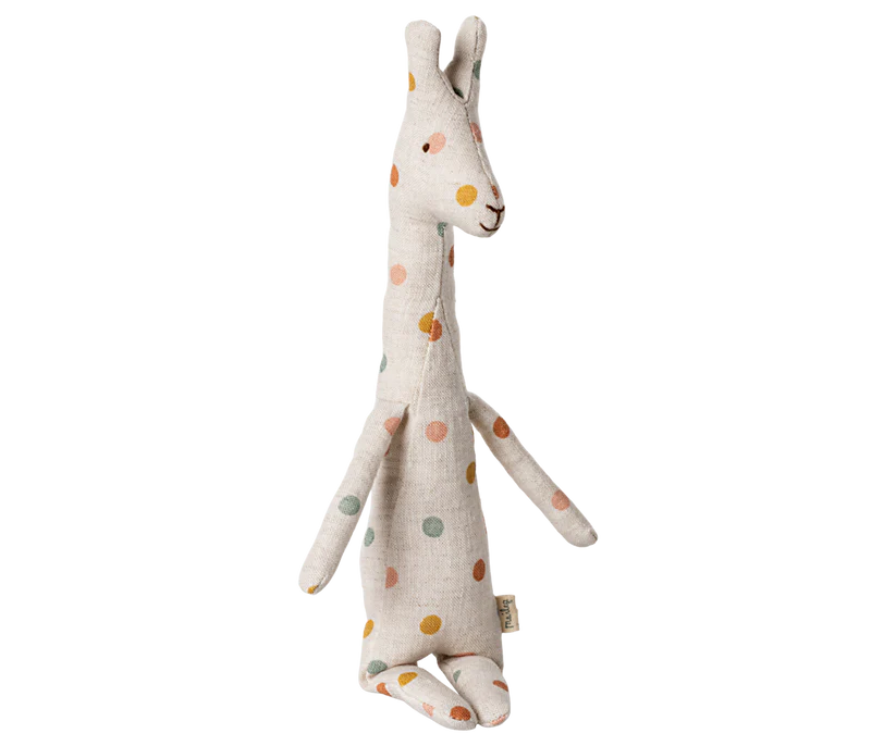 This Maileg Mini Giraffe Stuffed Animal from the Safari Friend collection showcases a charming long neck and a vibrant color pattern with orange, yellow, and green dotted fabric, making it a delightful addition to any playroom.