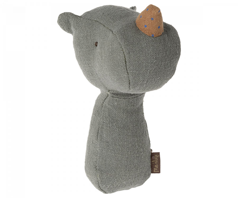 A Maileg Lullaby Friend Rattles, Rhino - Pine resembling an armadillo, made from soft, textured grey fabric with a pointed nose and small black eyes. It has brown accents on its nose and a small tag. Perfect for babies, this delightful toy even features a gentle rattle sound when shaken.