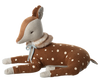 The Maileg Cosy Bambi - Mint is a soft, plush toy deer resting on its legs, featuring a brown body with white polka dots, and light gray snout and ears. It has a fluffy collar around its neck tied with a blue ribbon, giving it an adorable and endearing appearance—perfect for decoration or play.