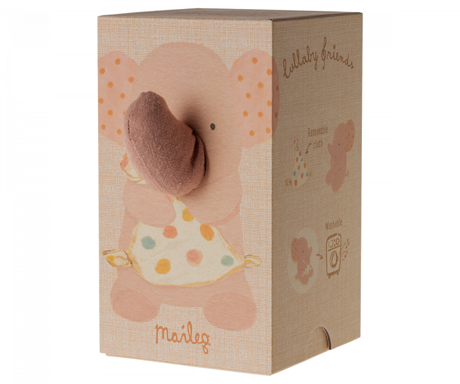 A light brown cardboard baby gift box with an illustration of a cute elephant holding a polka-dot apron on its front. The box has a soft, pink stuffed trunk protruding from the front and is labeled with the brand name "Maileg Lullaby Friends - Elephant - Old Rose (Plays Music)" and some playful text, making it perfect for lullaby friends.