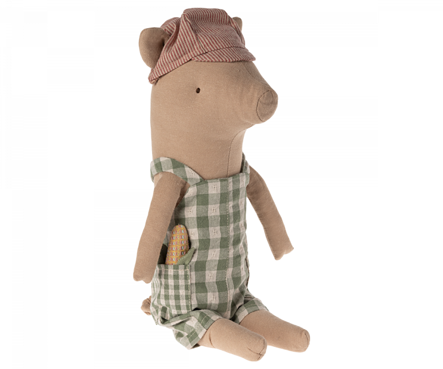 A Maileg Pig - Boy wearing a checkered green and white outfit and a red-striped cap sits upright. The pig has a small patch detail on its clothes and a friendly, minimalist facial expression. Perfect for those looking to create your own pig family, this adorable companion is isolated on a white background.