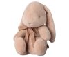 The PRE-ORDER Maileg Plush Bunny - Light Powder, shipping in February, is an adorable plush companion with long ears, a small nose, black eyes, soft fabric, and a matching brown ribbon around its neck.