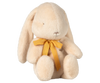 The Maileg Plush Bunny - Small Cream, available for pre-order and shipping in February, features floppy ears, a yellow neck bow, a cream color, is made from soft recycled polyester and has embroidered closed eyes for a peaceful look.