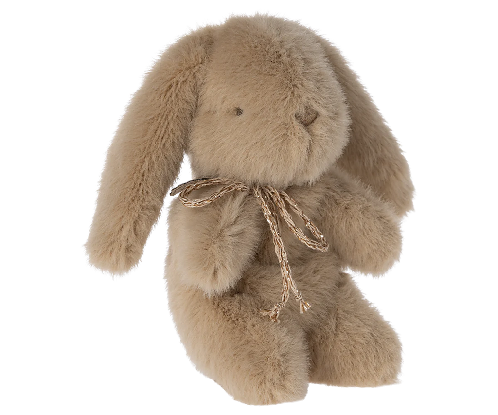 A Maileg Mini Bunny & Trolley Set with long floppy ears and a decorative twine bow around its neck, crafted from washable fabric, sitting on a white background.