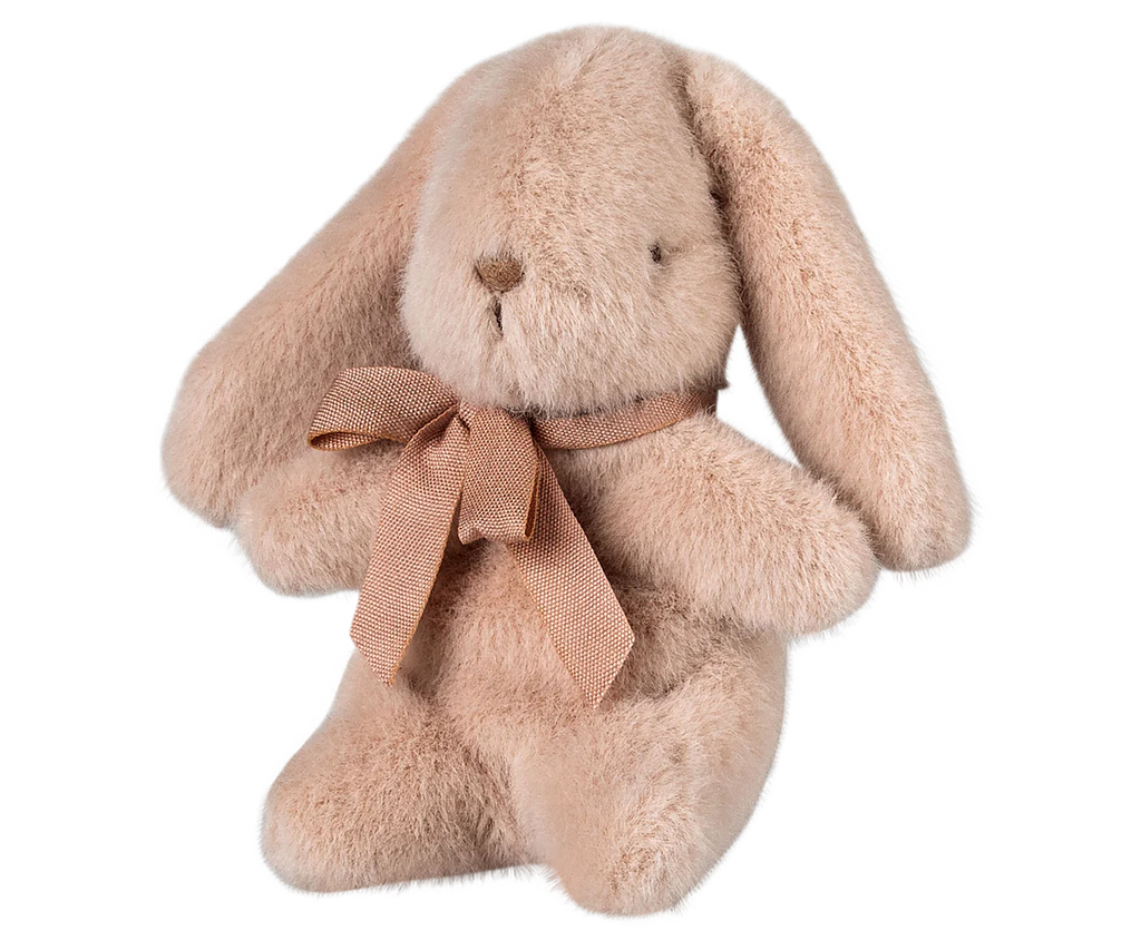 The PRE-ORDER Maileg Plush Bunny in Light Powder, shipping late February, is a soft plush toy made from recycled materials. It sits upright with long ears and a cozy polyester filling, featuring a brown ribbon around its neck.