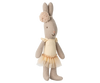 A soft Maileg Rabbit, Micro in cream, dressed in a ballet suit and skirt, stands upright against a neutral striped background.