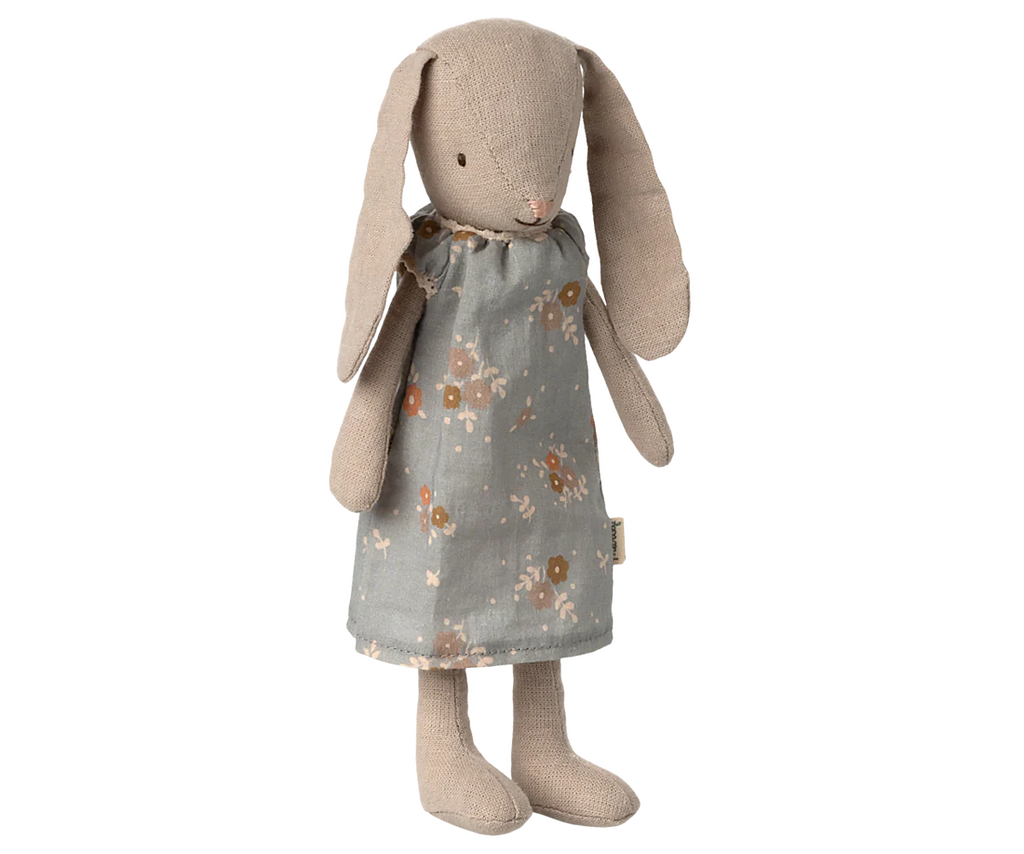 The Maileg Bunny, Size 1 - Classic - Dress is a miniature toy with long floppy ears, wearing a blue-gray floral dress. Made from soft natural fabrics, it features simple stitched facial details and stands upright.