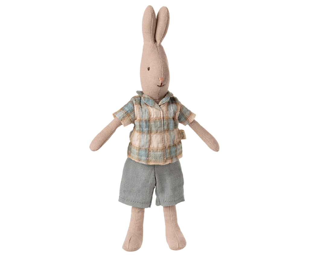 The Maileg Rabbit, Size 1 - Classic, wears a plaid shirt and denim shorts and stands upright with outstretched arms, making it perfect for pairing with miniature furniture.