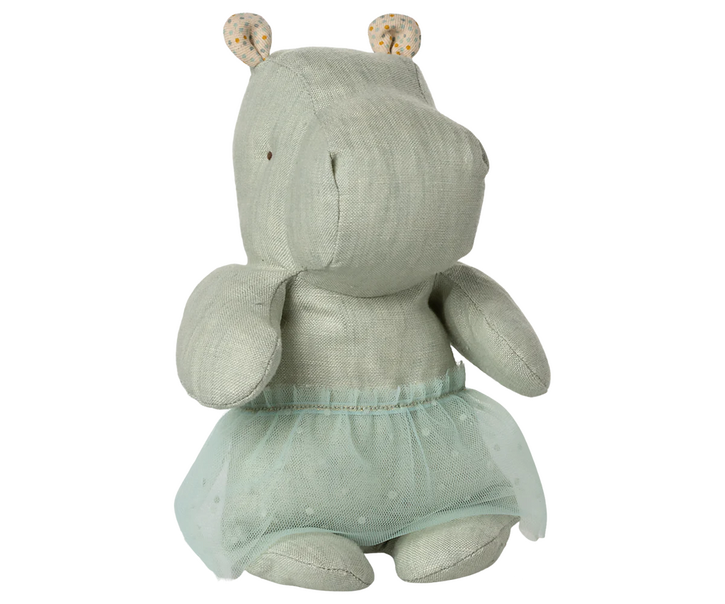 The Maileg Small Hippo With Skirt Stuffed Animal - Mint is a soft, light green hippo from the Safari Friends collection, dressed in a pale blue dotted ballerina skirt with patterned-ear lining and stitched facial details.