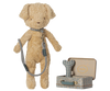 The Maileg Puppy Supply Accessories - Blue includes a soft plush dog with collar and leash, standing beside two metal suitcases—one open, one closed—with charming Maileg prints and a bone-shaped toy inside.