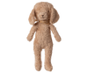The Maileg Poodle Dog, Vintage Plush in Dusty Powder stands upright against a plain background, featuring floppy ears, a fuzzy light brown coat, and a tan scarf around its neck.