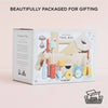 A box labeled "Tool Box & Wooden Tools" with toy tools is displayed against a light background. Text reads "Beautifully Packaged for Gifting." The set builds fine motor skills and comes in 100% recyclable packaging.