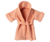 An Maileg Extra Clothing: Bathrobe - Coral, displayed against a plain white background. The soft bathrobe features a waffle-knit pattern and an open front with a thick collar.