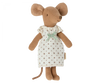 A Maileg Big Sister Mouse in Box standing, dressed in a white dress with small brown prints and a green bow at the neck, against a black background.