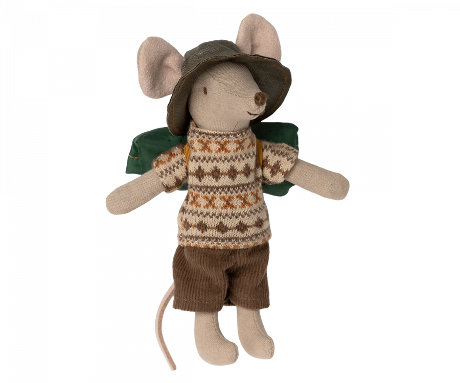 A Maileg Hiker Mouse, Big Brother wearing a patterned sweater, brown shorts, and a hat, with a green backpack, isolated on a black background.