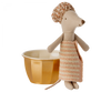 A Maileg Wellness Mouse, Big Sister (Rose) with a textured floral shower cap and striped dress, standing next to a yellow ceramic bowl on a black background.