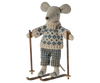 The Maileg Winter Mouse with Ski Set, Dad, features a dad mouse dressed in a knitted sweater and plaid pants, standing on wooden skis and holding two ski poles.