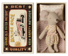 The Maileg Little Sister Bedroom Starter Set features a stuffed toy mouse in a polka dot outfit lying in a miniature bed with a pink blanket and white pillow, all within a vintage-style matchbox labeled "Mouse Race." Perfect for Maileg enthusiasts, but beware of potential choking hazards.