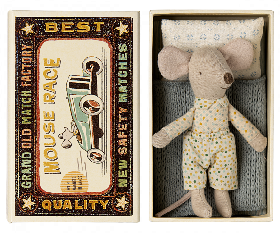 A vintage-style matchbox bed with the text "Best Grand Old Factory Mouse Race Safety Matches" on the left and a Maileg Little Brother mouse in a floral jumpsuit resting inside an open matchbox on the right.