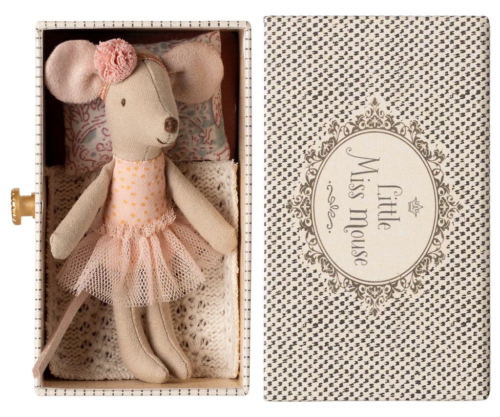 The Maileg Dancing Mouse in Daybed comes in a small decorative box labeled "Little Miss Mouse," featuring a stuffed toy mouse dressed in a pink tutu and flower headband. Complete with a floral pillow and lace bedding, it's like her own tiny day bed after an imagined dance lesson.