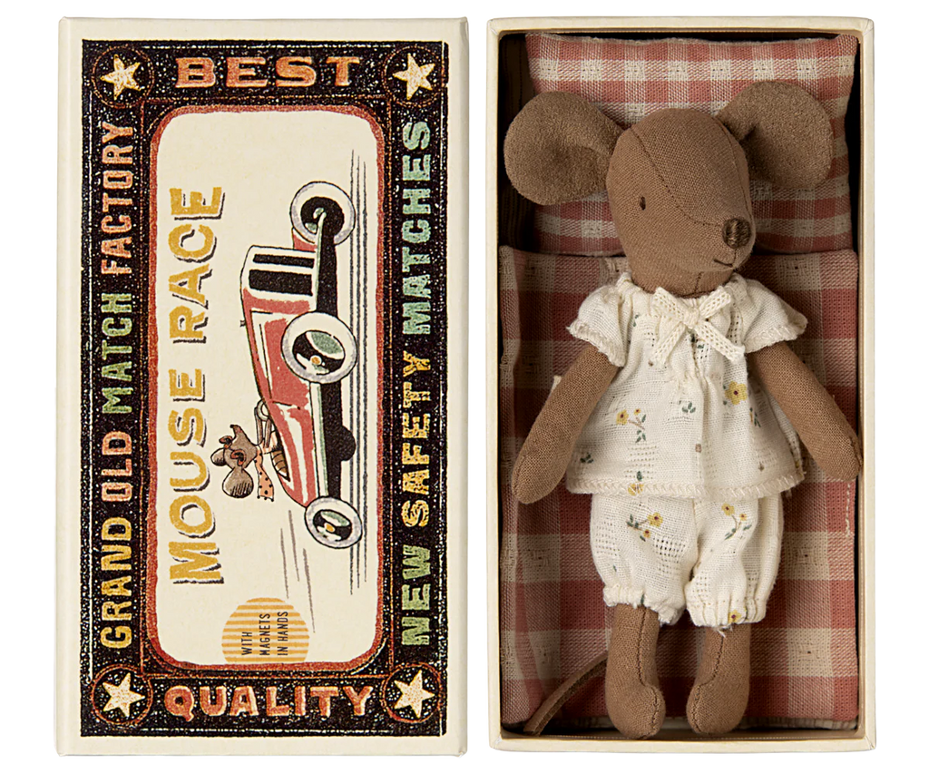 A small cloth mouse toy dressed in white clothing rests in an open matchbox. The box displays a vintage car design with "Grand Old Match Factory," "Best Quality," and "Mouse Race New Safety Matches." Contains small parts—choking hazard; not suitable for children under 3. Product: Maileg Bathroom Set.