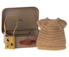 A Maileg Knitted Dress And Bag In Suitcase, Big Sister Mouse contains a tiny striped knit dress, perfect for a big sister/brother toy. Next to the suitcase is a brown fabric shoulder bag with a cutout design, ideal for children recommended age 3+.