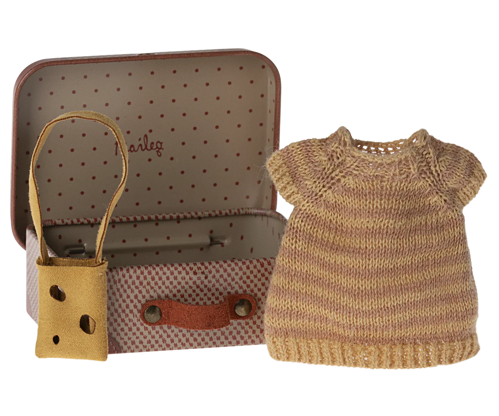 A Maileg Knitted Dress And Bag In Suitcase, Big Sister Mouse contains a tiny striped knit dress, perfect for a big sister/brother toy. Next to the suitcase is a brown fabric shoulder bag with a cutout design, ideal for children recommended age 3+.