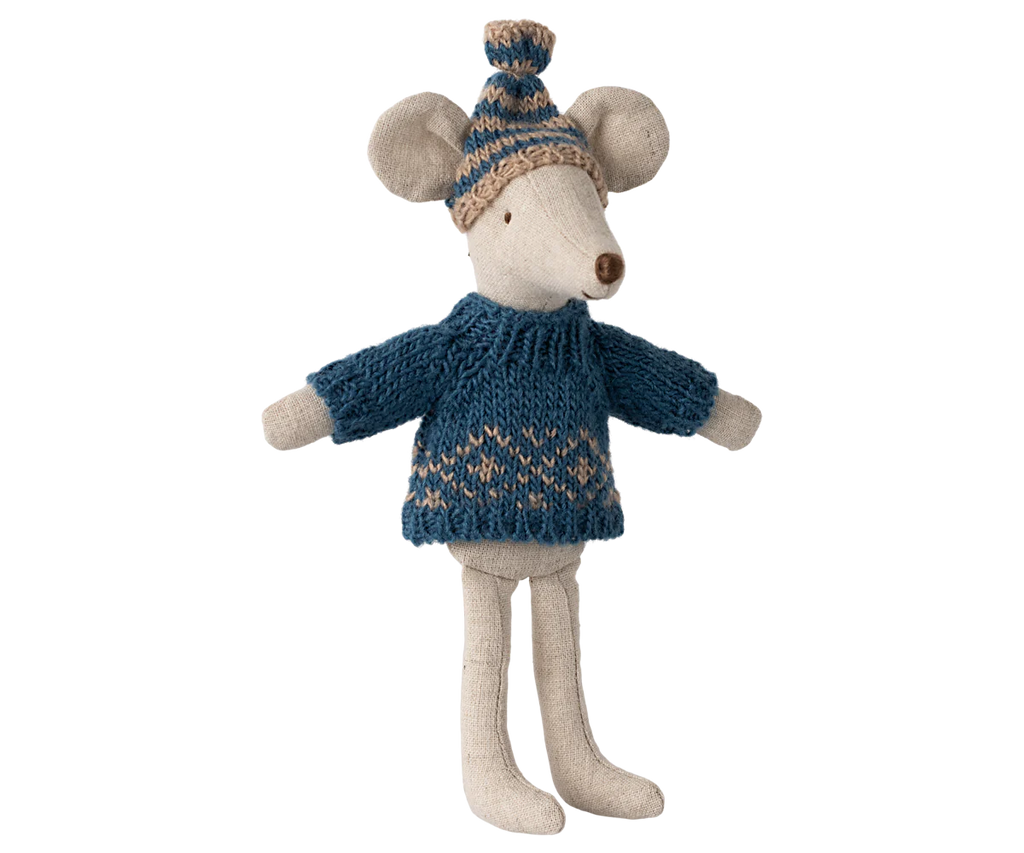 A plush Dad Mouse from Maileg is dressed in a knitted blue sweater featuring a charming Scandinavian pattern, complemented by a matching beanie hat. The mouse stands with its little arms outstretched, displaying its neutral expression while cozy in its winter attire.