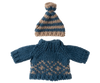 A Maileg knitted sweater in blue paired with a matching hat for Dad Mouse, featuring beige and blue stripes and topped with a pom-pom. Both pieces are designed with a cozy texture reminiscent of Scandinavian winter patterns.