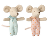 The Maileg Twin Baby Mice in Matchbox set, ready for pre-order, features two plush mice: one in a starry blue outfit with a scarf and the other in a pink polka dot ensemble with a matching scarf. Both have beige ears and tails, cheerful expressions, and fit perfectly in their cozy matchbox bed.