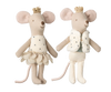 The Maileg Royal Twin Mice in a Matchbox, Little Sister & Brother are cream-colored with pink ears and tails. One wears a petal-like dress, while the other sports a fuzzy vest and polka-dot shorts. Both come with golden crowns, adding charm as they perch on a decorated matchbox.