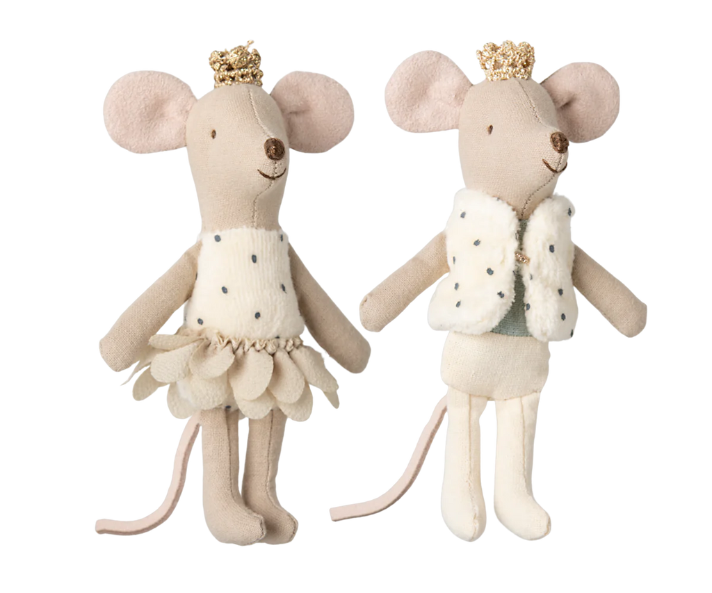 The Maileg Royal Twin Mice in a Matchbox, Little Sister & Brother are cream-colored with pink ears and tails. One wears a petal-like dress, while the other sports a fuzzy vest and polka-dot shorts. Both come with golden crowns, adding charm as they perch on a decorated matchbox.