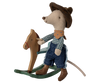 The Maileg Cowboy Mouse On Rocking Horse, Little Brother—dressed in a hat, bandana, plaid shirt, jeans, and boots—is an adorable play set addition. Ships in one week.