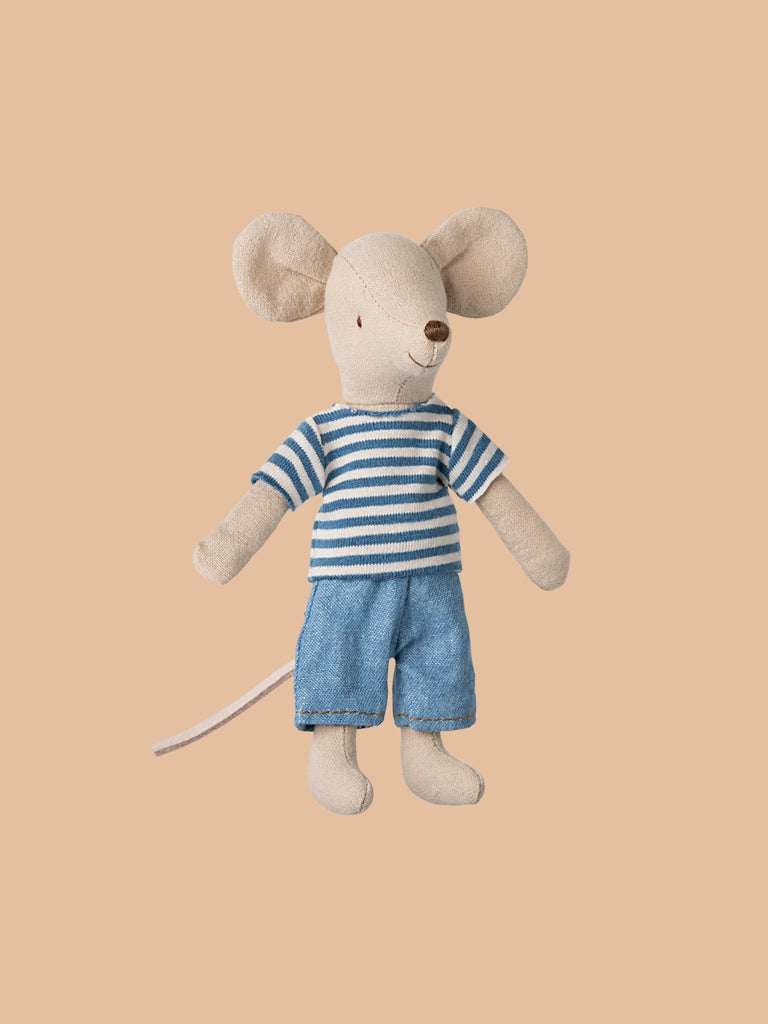 Introducing the Maileg LouisMax Mouse - Big Brother, a plush toy made of soft cotton. Dressed in a chic blue and white striped outfit, this adventurous mouse is set against a simple peach backdrop, ready for endless imaginative adventures. Pre-orders ship late February!.