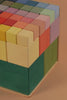Close-up view of a Raduga Grez | Big Cube Block Set - Colorful puzzle, with pastel shades ranging from purple to green, showcasing an array of neatly aligned colorful cubes.