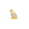 The Ostheimer Bird - Bald Eagle, Small is a handcrafted wooden figurine featuring a light natural wood body, yellow beak and feet, and a simple painted black eye, inspired by Ostheimer toys and shown on a white background.