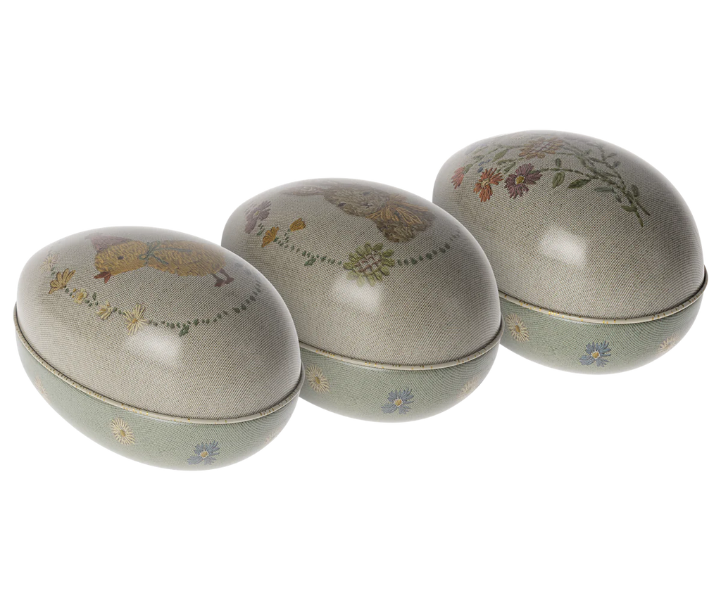 Three decorative oval boxes with intricate floral and bird motifs, presented against a white background, featuring Maileg Easter Egg designs.