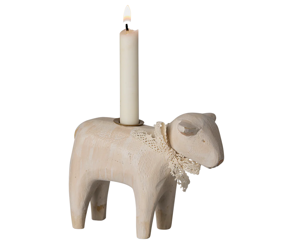 The Maileg Wooden Candle Holder, an off-white lamb with a lace collar and lit white candle, creates the ideal centerpiece for your Easter table. Pre-order now for shipment in late January.