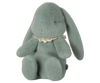 The PRE-ORDER: Maileg Easter Egg With Bunny - Mint (Ships in February) features a soft, plush green rabbit toy made from recycled polyester with long ears and a stitched pink nose, wearing a lace collar. It has minimalist stitched eyes and sits upright against a plain white background.