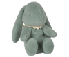 The Maileg Easter Egg With Bunny - Mint, available for pre-order and shipping in February, features a plush teal bunny with long ears, a small embroidered nose, and a lacy white collar. Made from recycled polyester, it sits upright with a soft, textured surface for a charming and cuddly look.