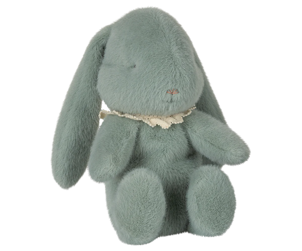 The Maileg Easter Egg With Bunny - Mint, available for pre-order and shipping in February, features a plush teal bunny with long ears, a small embroidered nose, and a lacy white collar. Made from recycled polyester, it sits upright with a soft, textured surface for a charming and cuddly look.